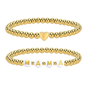 Gold beaded bracelet set with heart charm and white MAMA letter beads on white background