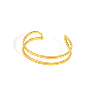 Detail of a minimalist gold-plated double-layer geometric open cuff bracelet for women