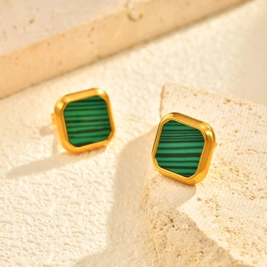 Square gold-plated earrings with green malachite stone inlay on natural stone base