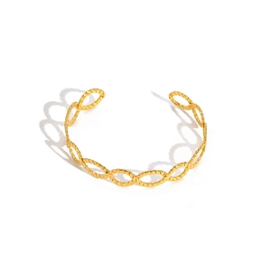 Close-up of golden 18K twisted cable open bangle with intricate hollow oval link texture