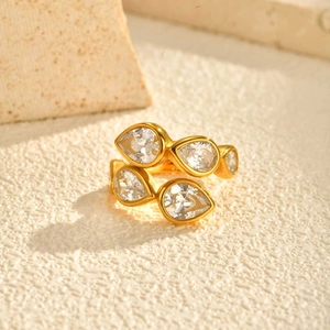 Elegant gold-plated stainless steel ring with four pear-shaped cubic zirconia stones