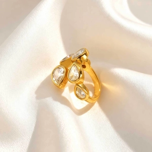 Luxurious gold stainless steel ring with pear-cut cubic zirconia in a cluster design