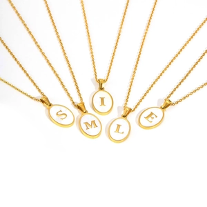 Gold oval white enamel letter necklace set spelling SMILE in stainless steel