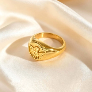Vintage gold stainless steel signet ring with detailed Cupid embossed relief