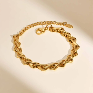 Detail of gold geometric link bracelet with lobster clasp and adjustable chain