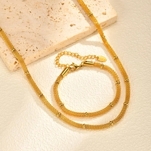 Minimalist gold mesh chain necklace and bracelet set with delicate spherical beads