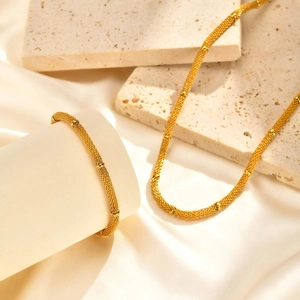 Vintage gold mesh chain necklace and bracelet set with delicate polished beads on silk