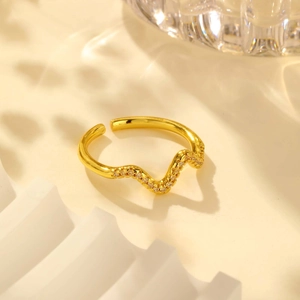 Elegant gold wave ring with sparkling zircons and minimalist open adjustable band design