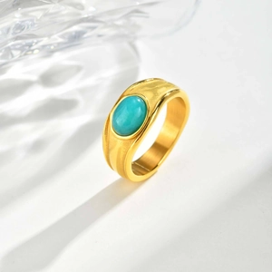 Vintage gold stainless steel wide ring featuring an oval turquoise gemstone inlay