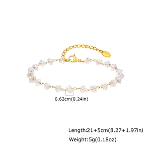 Detailed view of irregular clear beads and gold stainless steel chain bracelet