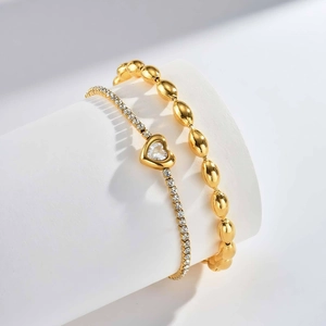 Golden heart tennis bracelet set with zircon stones and polished football bead chain link