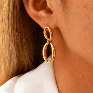 French style gold plated oval double link earrings on model for a minimalist chic look