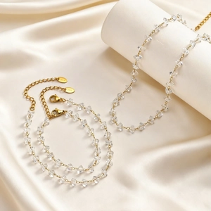 Minimalist gold stainless steel jewelry set with transparent crystals and chain links