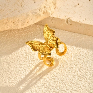 Macro shot of detailed golden butterfly wing texture on a double-track adjustable ring