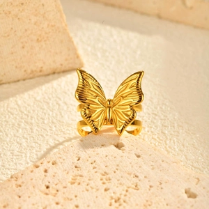 Exquisite golden butterfly open ring with double-layered band on stone pedestal