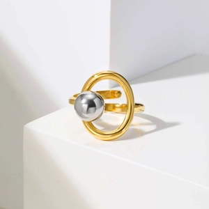 Detailed view of adjustable golden band and silver bead in a geometric overlapping design