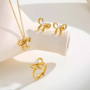 Conjunto de joyas lazo dorado con collar colgante circón corazón pendientes y anillo