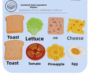 Macro view of wooden toy food pieces including bread, egg, bacon and vegetables
