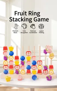 Detail of wooden fruit stacking toy on a white table for toddler sensory motor skill development