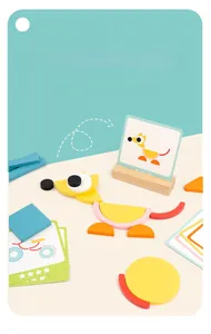 Educational wooden geometric puzzles with colorful shapes and animal pattern reference cards