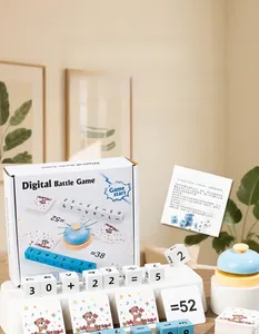 Close-up of wooden number blocks, challenge cards, and a buzzer for math board games