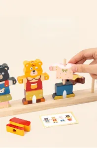 Detailed view of child's wooden bear dress-up puzzle with stacking pegs and pattern cards