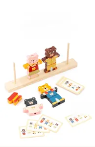 Macro detail of wooden bear dressing puzzle with base, colorful pieces and challenge cards
