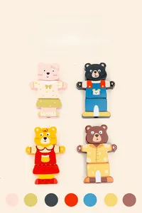Detail of wooden bear dress-up puzzle set with various colorful outfits and outfits sets