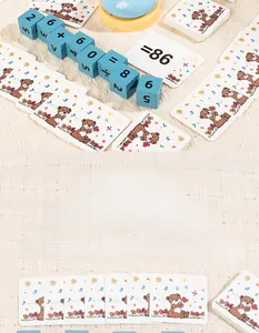 Detail of wooden math blocks with printed numbers and cute bear calculation cards