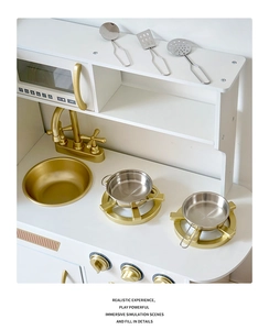Detail of wooden play kitchen with golden faucet and stove knobs for kids set