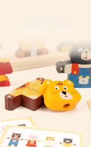 Detail of wooden bear dressing toy with colorful sorting blocks and pattern cards