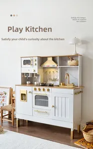 Detailed view of luxury white and gold wooden toy kitchen with oven and microwave