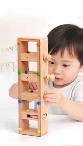 Toddler playing with wooden puzzle game focusing on hand-eye coordination training