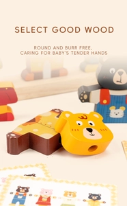 Detail of polished wooden bear bead showing smooth edges and safe threading hole for kids