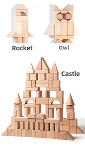Macro view showing wooden building blocks assembled as a rocket, owl, and large castle