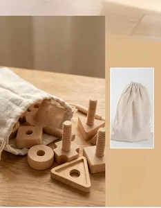 Detail view of smooth wooden nuts, threaded bolts, and a linen drawstring storage bag