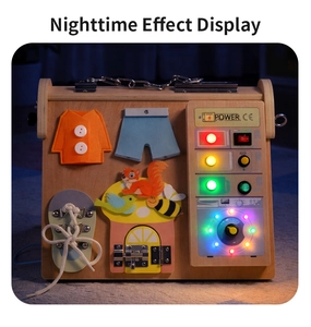 Detail showing illuminated LED lights and power switch on the wooden busy board for kids