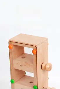Close-up of polished wooden puzzle frame with smooth edges and colorful pegs