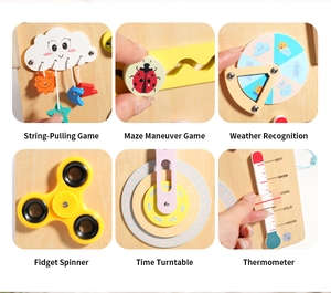 Detail view of wooden busy board with spinner, weather dial, and maze for toddler learning