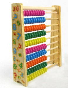 Macro view of wooden abacus side panel with colorful printed numbers and math symbols