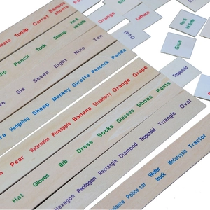 Detail view of colorful English words on natural wood blocks for early learning