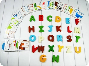 Detail of wooden alphabet blocks with colorful animal matching cards for kids learning