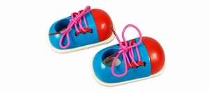 Detail of wooden shoe tying toy set with colorful design for toddler fine motor skills training