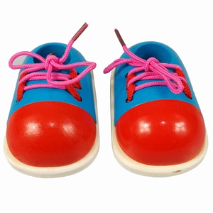 Wooden toy shoes for kids learning to tie laces in bright red and blue colors