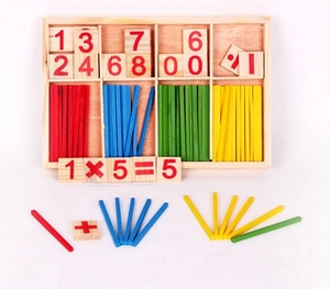 Detail of wooden math learning set with colorful counting sticks and number blocks