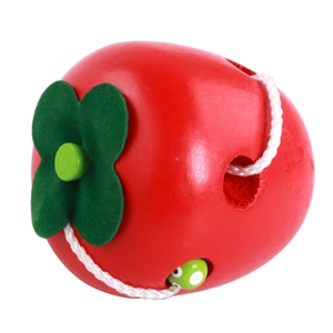 Wooden apple threading toy for toddlers with red finish and green worm-shaped lace bead