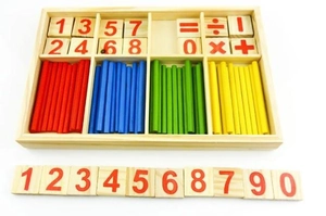 Top view of wooden math kit with colored counting sticks and numbered square blocks