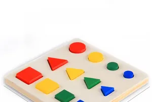 Close-up of wooden Montessori shape matching puzzles with colorful geometric blocks