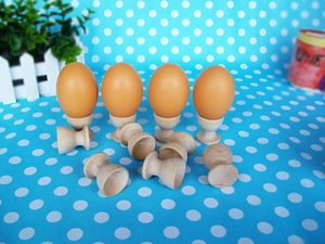 Detail view of miniature wooden egg holders for kitchen role-play toys and decoration