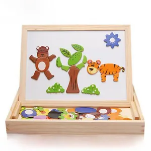 Close-up of animal magnetic puzzle with wooden white board and various magnets